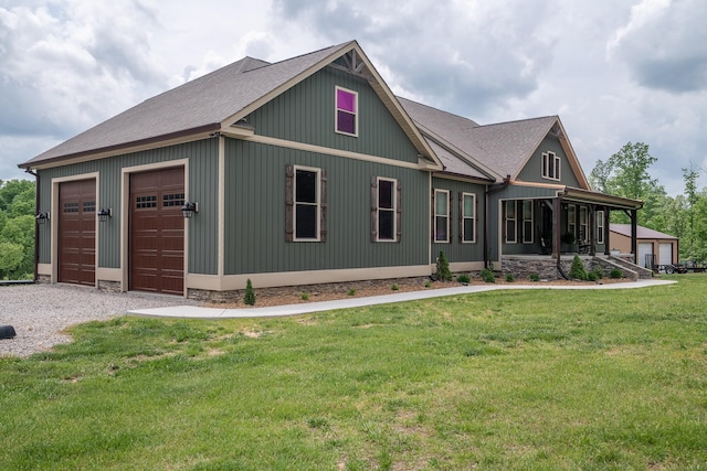 217 Rockhouse Rd, Hohenwald, TN 38462 - craftsman-style house with roof with shingles, a detached garage, and a front lawn