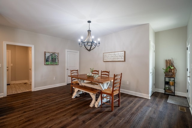 217 Rockhouse Rd, Hohenwald, TN 38462 - dining area featuring baseboards, visible vents, dark wood-style floors, and a chandelier