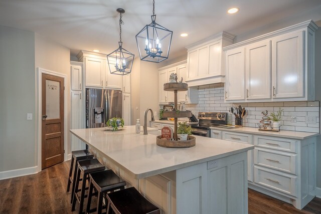 217 Rockhouse Rd, Hohenwald, TN 38462 - kitchen with light countertops, a chandelier, stainless steel appliances, recessed lighting, and decorative backsplash