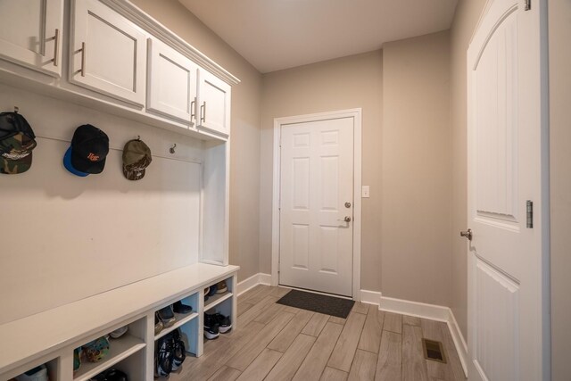 217 Rockhouse Rd, Hohenwald, TN 38462 - mudroom featuring baseboards, light wood finished floors, and visible vents