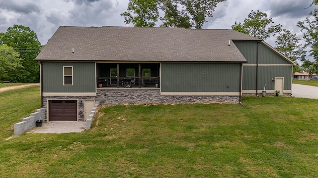217 Rockhouse Rd, Hohenwald, TN 38462 - back of property with a garage, roof with shingles, a yard, and stone siding