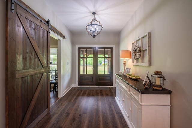 217 Rockhouse Rd, Hohenwald, TN 38462 - doorway to outside with french doors, dark wood finished floors, a barn door, baseboards, and a notable chandelier