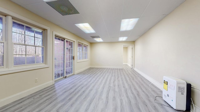 309 New Kent Ct, Tullahoma, TN 37388 - unfurnished room featuring baseboards, wood finished floors, and a paneled ceiling