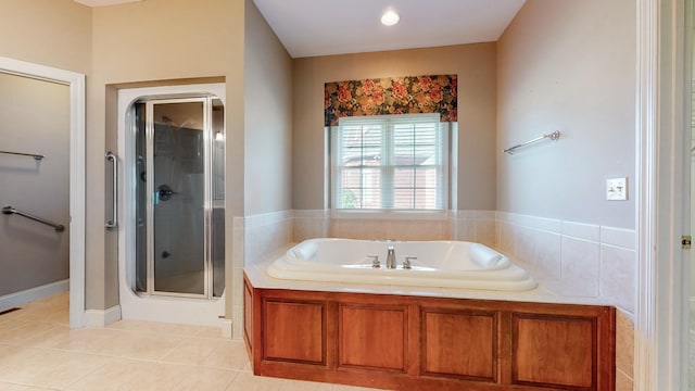 309 New Kent Ct, Tullahoma, TN 37388 - full bath featuring tile patterned flooring, a shower stall, and a garden tub