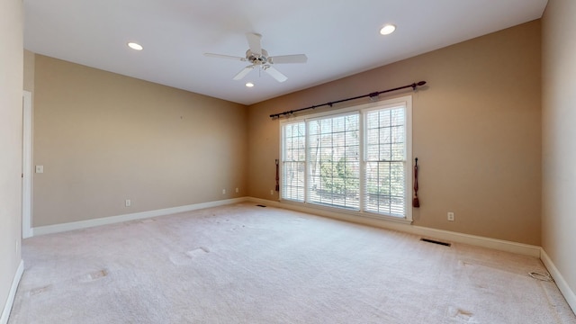 309 New Kent Ct, Tullahoma, TN 37388 - spare room featuring baseboards, ceiling fan, light colored carpet, and visible vents