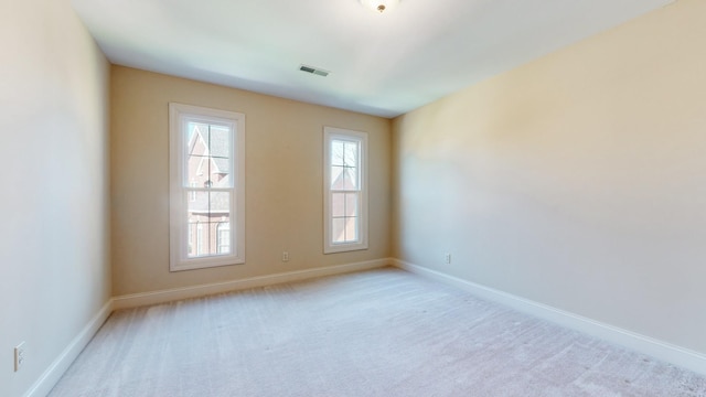 309 New Kent Ct, Tullahoma, TN 37388 - unfurnished room featuring baseboards, light colored carpet, and visible vents