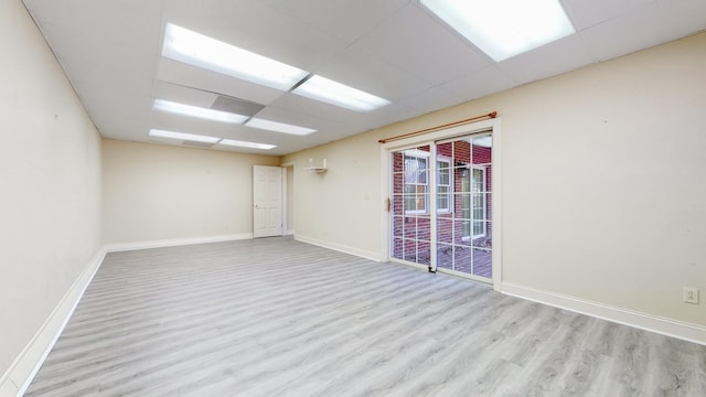 309 New Kent Ct, Tullahoma, TN 37388 - unfurnished room with baseboards, wood finished floors, and a paneled ceiling