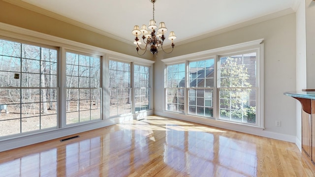 309 New Kent Ct, Tullahoma, TN 37388 - unfurnished dining area with visible vents, wood finished floors, baseboards, a chandelier, and ornamental molding