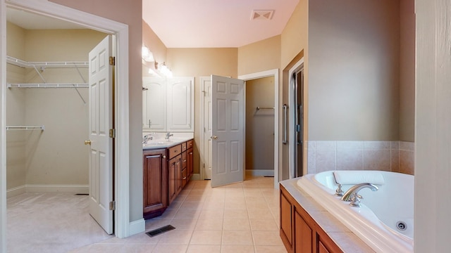 309 New Kent Ct, Tullahoma, TN 37388 - full bath featuring visible vents, a jetted tub, a walk in closet, and vanity