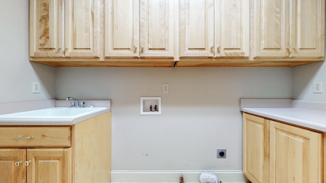 309 New Kent Ct, Tullahoma, TN 37388 - laundry area featuring cabinet space, washer hookup, hookup for an electric dryer, and a sink