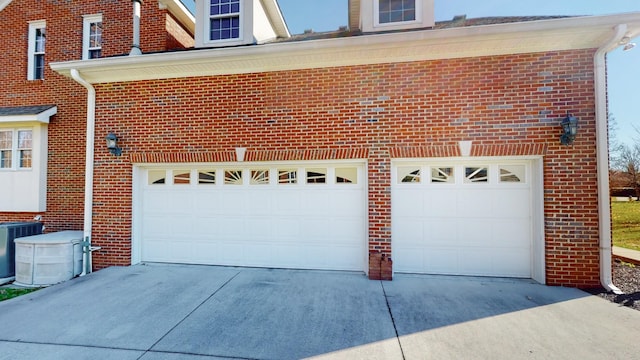 309 New Kent Ct, Tullahoma, TN 37388 - garage with central AC unit and driveway