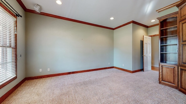 309 New Kent Ct, Tullahoma, TN 37388 - unfurnished room featuring light colored carpet, crown molding, and a healthy amount of sunlight
