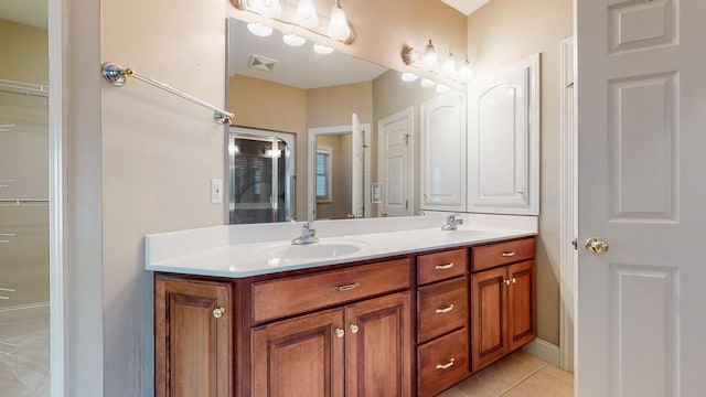 309 New Kent Ct, Tullahoma, TN 37388 - bathroom featuring double vanity, a sink, tile patterned flooring, and visible vents