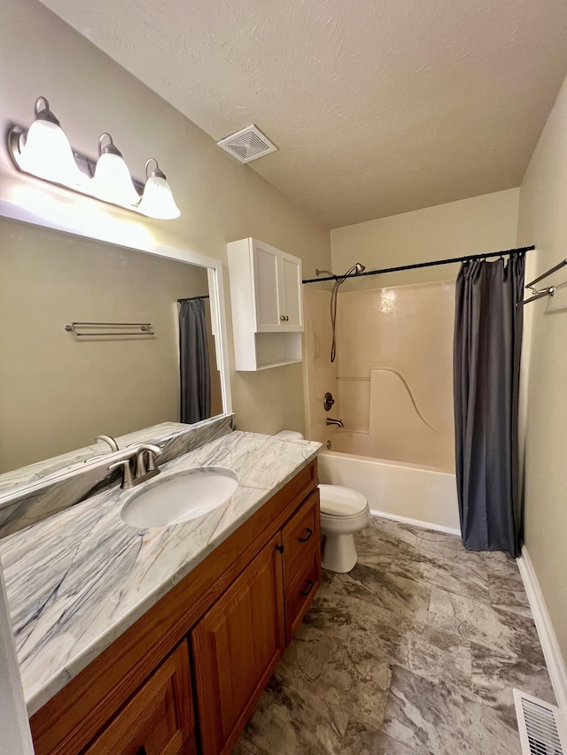 bathroom featuring visible vents, vanity, baseboards, toilet, and shower / bath combo with shower curtain