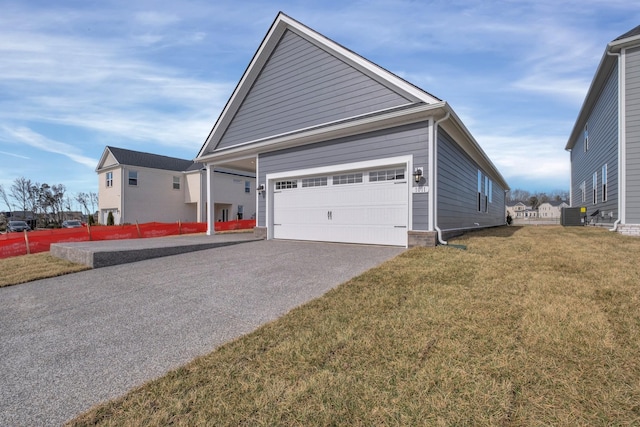 1105 Codah Dr, Mount Juliet, TN 37122 - view of side of home featuring a garage, central AC unit, a lawn, and driveway