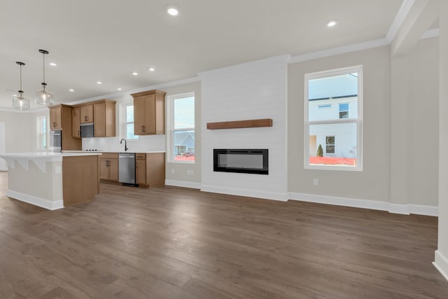 1105 Codah Dr, Mount Juliet, TN 37122 - kitchen with a center island, ornamental molding, baseboards, and appliances with stainless steel finishes