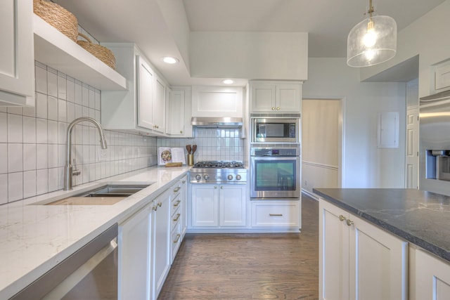 601 Foxborough Sq W, Brentwood, TN 37027 - kitchen featuring stainless steel appliances, a sink, dark wood-type flooring, dark stone countertops, and recessed lighting