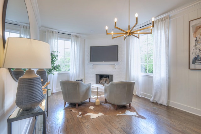 601 Foxborough Sq W, Brentwood, TN 37027 - living room featuring ornamental molding, healthy amount of natural light, a chandelier, wood finished floors, and baseboards
