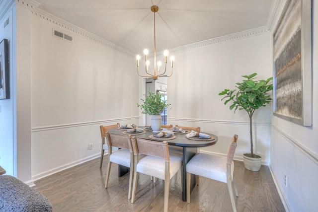601 Foxborough Sq W, Brentwood, TN 37027 - dining room featuring wood finished floors, a chandelier, crown molding, and baseboards