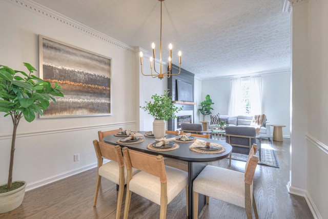 601 Foxborough Sq W, Brentwood, TN 37027 - dining space featuring wood finished floors, a chandelier, baseboards, ornamental molding, and a textured ceiling