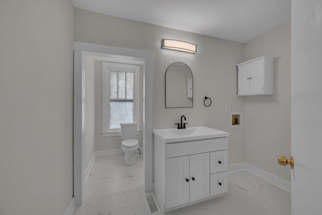 2408 Elliott Dr, Old Hickory, TN 37138 - bathroom featuring visible vents, vanity, marble finish floor, toilet, and baseboards