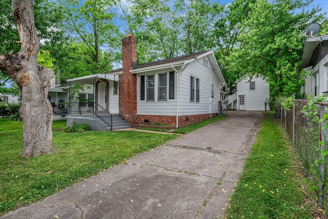 2408 Elliott Dr, Old Hickory, TN 37138 - view of front of house featuring fence, a front yard, a chimney, crawl space, and a porch