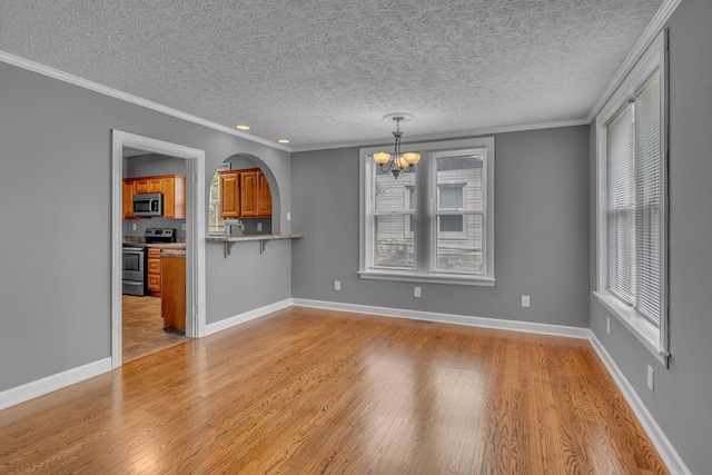 2408 Elliott Dr, Old Hickory, TN 37138 - unfurnished dining area with an inviting chandelier, a textured ceiling, and light wood-type flooring