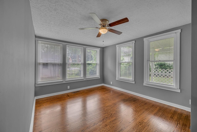 2408 Elliott Dr, Old Hickory, TN 37138 - spare room featuring a textured ceiling, a ceiling fan, baseboards, wood finished floors, and visible vents
