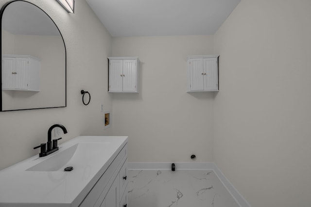 2408 Elliott Dr, Old Hickory, TN 37138 - clothes washing area featuring marble finish floor, baseboards, cabinet space, a sink, and washer hookup