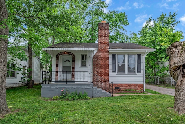 2408 Elliott Dr, Old Hickory, TN 37138 - view of front of home featuring a front lawn, roof with shingles, crawl space, and a chimney