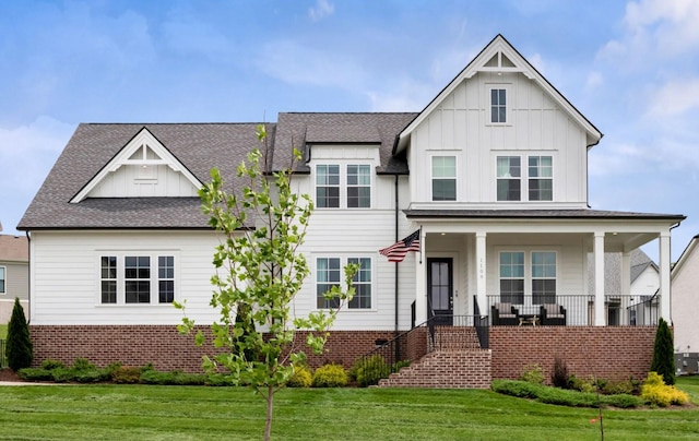 1109 Angela Ann Ct, Nolensville, TN 37135 - view of front facade featuring a front yard, roof with shingles, board and batten siding, a porch, and stairway