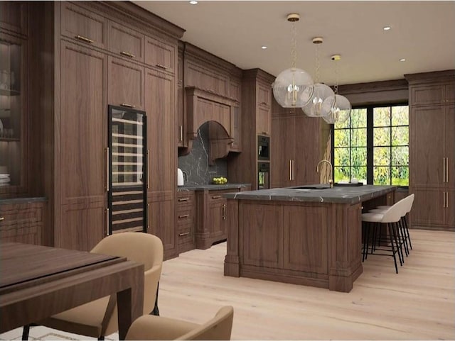 0 Old Pond Ln, Dickson, TN 37055 - kitchen featuring light wood-style floors, a kitchen bar, dark countertops, a sink, and wine cooler
