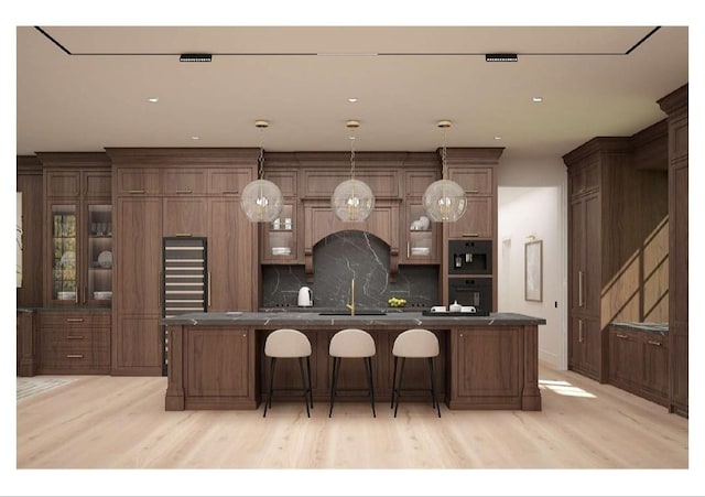 0 Old Pond Ln, Dickson, TN 37055 - kitchen featuring a sink, light wood finished floors, dark countertops, and a spacious island
