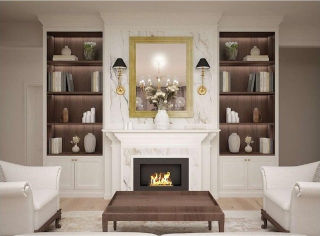 0 Old Pond Ln, Dickson, TN 37055 - sitting room with a high end fireplace, built in shelves, wood finished floors, and a chandelier