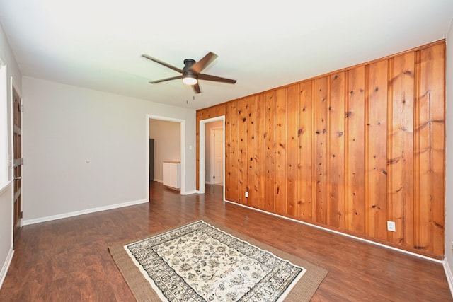 102 Moore Ave, Portland, TN 37148 - empty room featuring wooden walls, baseboards, ceiling fan, and wood finished floors