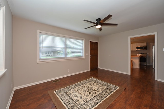 102 Moore Ave, Portland, TN 37148 - empty room featuring dark wood-style flooring, a ceiling fan, and baseboards
