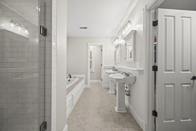 6437 Arno Rd, College Grove, TN 37046 - bathroom with a garden tub, tile patterned flooring, a shower stall, and baseboards
