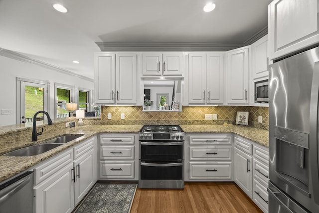 6437 Arno Rd, College Grove, TN 37046 - kitchen featuring stainless steel appliances, a sink, white cabinetry, crown molding, and recessed lighting