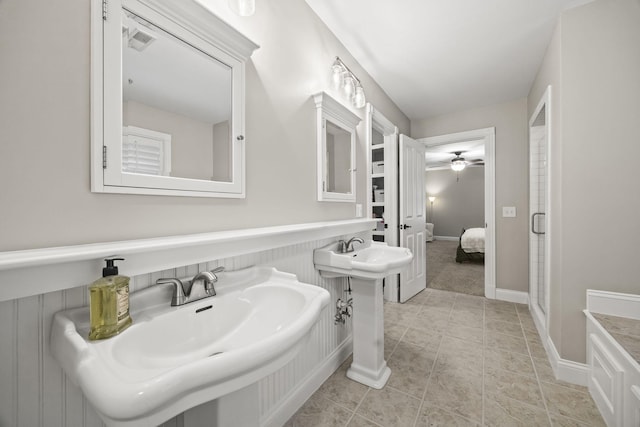 6437 Arno Rd, College Grove, TN 37046 - ensuite bathroom with a ceiling fan, tile patterned floors, and two sinks