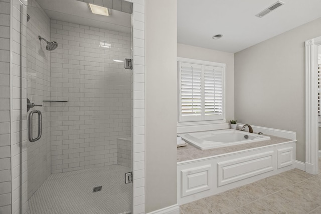 6437 Arno Rd, College Grove, TN 37046 - full bath with a stall shower, a garden tub, tile patterned flooring, and baseboards