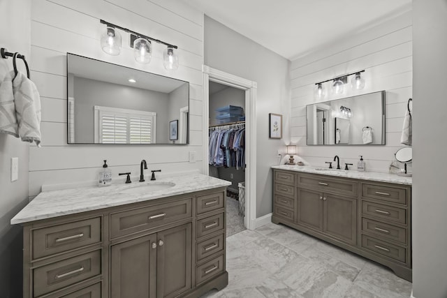 6437 Arno Rd, College Grove, TN 37046 - bathroom featuring two vanities, marble finish floors, and a walk in closet