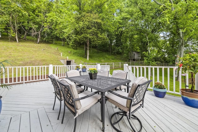 6437 Arno Rd, College Grove, TN 37046 - deck with outdoor dining space, a lawn, and view of scattered trees