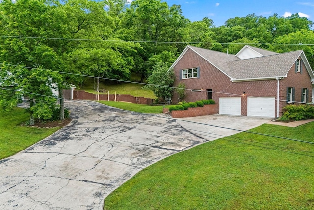 6437 Arno Rd, College Grove, TN 37046 - view of side of property with asphalt driveway, brick siding, a garage, and a lawn