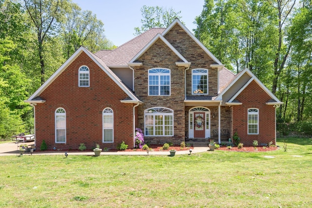 view of front of property featuring a front yard and stone siding