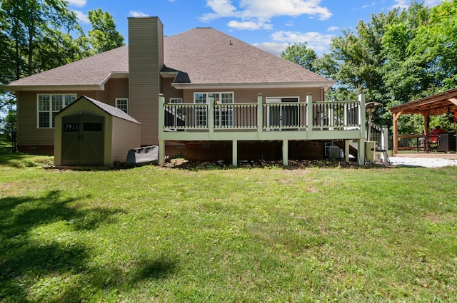 990 Iron Hill Rd, Burns, TN 37029 - rear view of property with a chimney, a deck, roof with shingles, and a yard