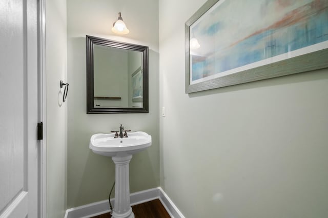 990 Iron Hill Rd, Burns, TN 37029 - bathroom with baseboards and wood finished floors