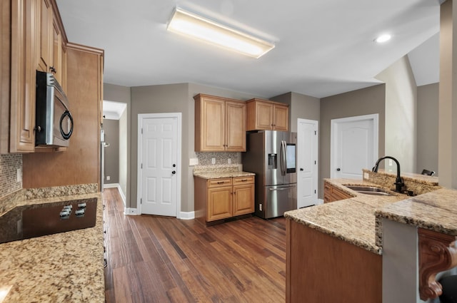 990 Iron Hill Rd, Burns, TN 37029 - kitchen featuring stainless steel appliances, a sink, tasteful backsplash, dark wood-style flooring, and light stone countertops