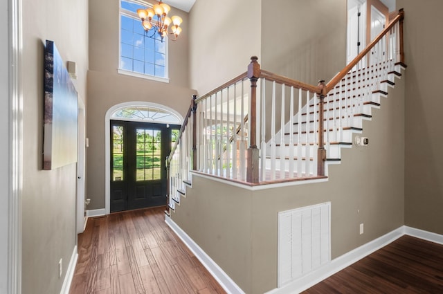 990 Iron Hill Rd, Burns, TN 37029 - entryway featuring a chandelier, baseboards, stairway, wood finished floors, and a towering ceiling