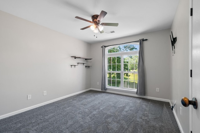 990 Iron Hill Rd, Burns, TN 37029 - spare room with a ceiling fan, baseboards, and dark colored carpet