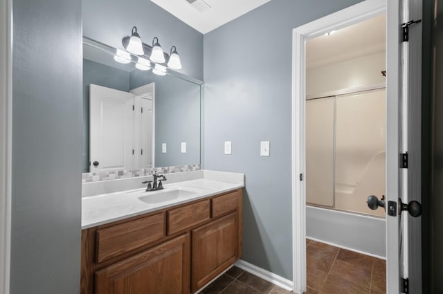 990 Iron Hill Rd, Burns, TN 37029 - bathroom featuring vanity, shower / bath combination with glass door, and baseboards